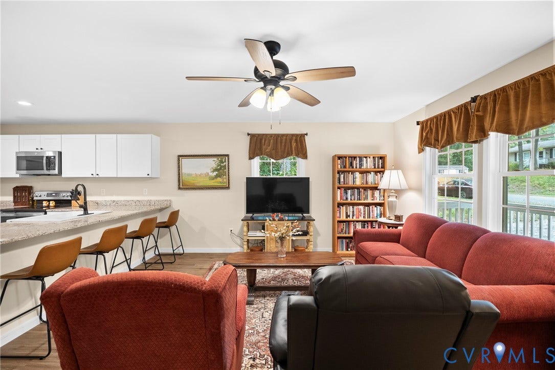 6626 Jackson Road, Quinton, VA 23141 Large windows fill the family room with natural light, creating a bright, comfortable living space.