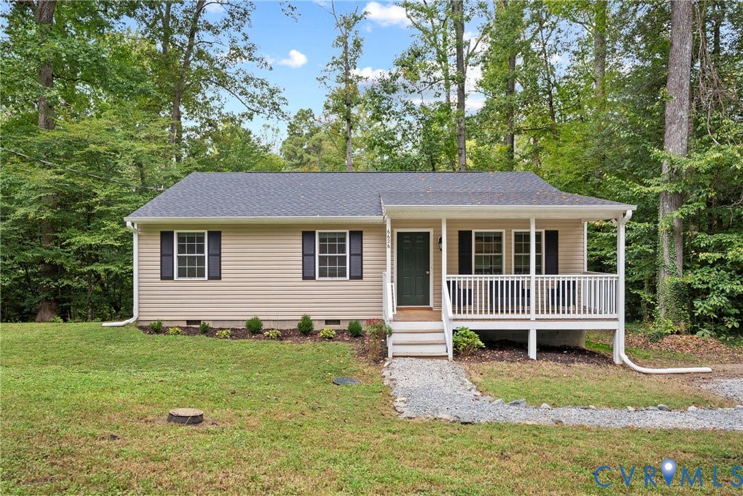 6626 Jackson Road, Quinton, VA 23141 This 2023-built ranch impresses with a covered front porch, tan siding, and a wooded, private setting.