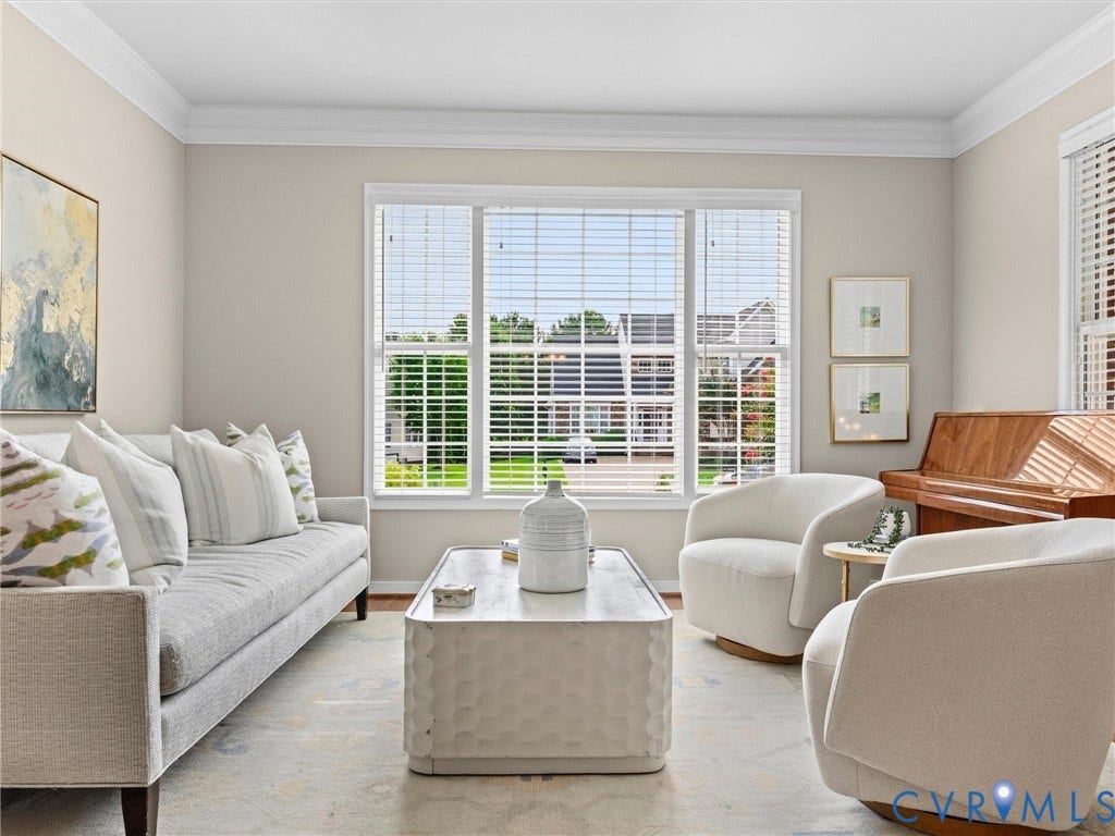 1663 Centerville Parke Lane, The Parke At Centerville, Manakin Sabot, VA 23103 Crown molding accents a spacious interior with light-toned walls and large windows, complemented by wood-finish flooring