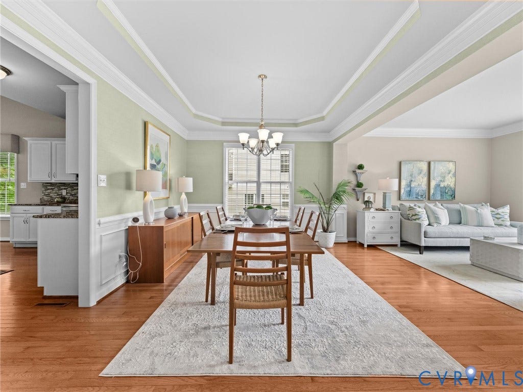 1663 Centerville Parke Lane, The Parke At Centerville, Manakin Sabot, VA 23103 Hardwood-style flooring throughout, tray ceiling with crown molding, white chair rail molding, and a chandelier lighting fixture