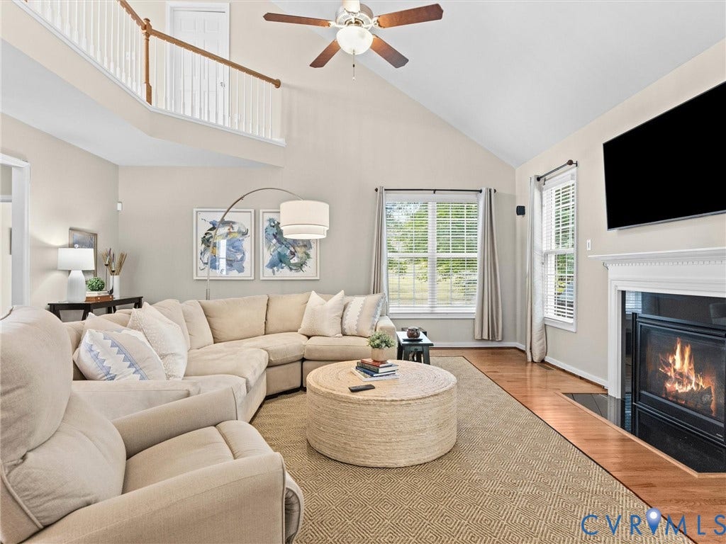 1663 Centerville Parke Lane, The Parke At Centerville, Manakin Sabot, VA 23103 Vaulted ceiling with an overhead fan, hardwood flooring, fireplace with a mantel, and architectural railing