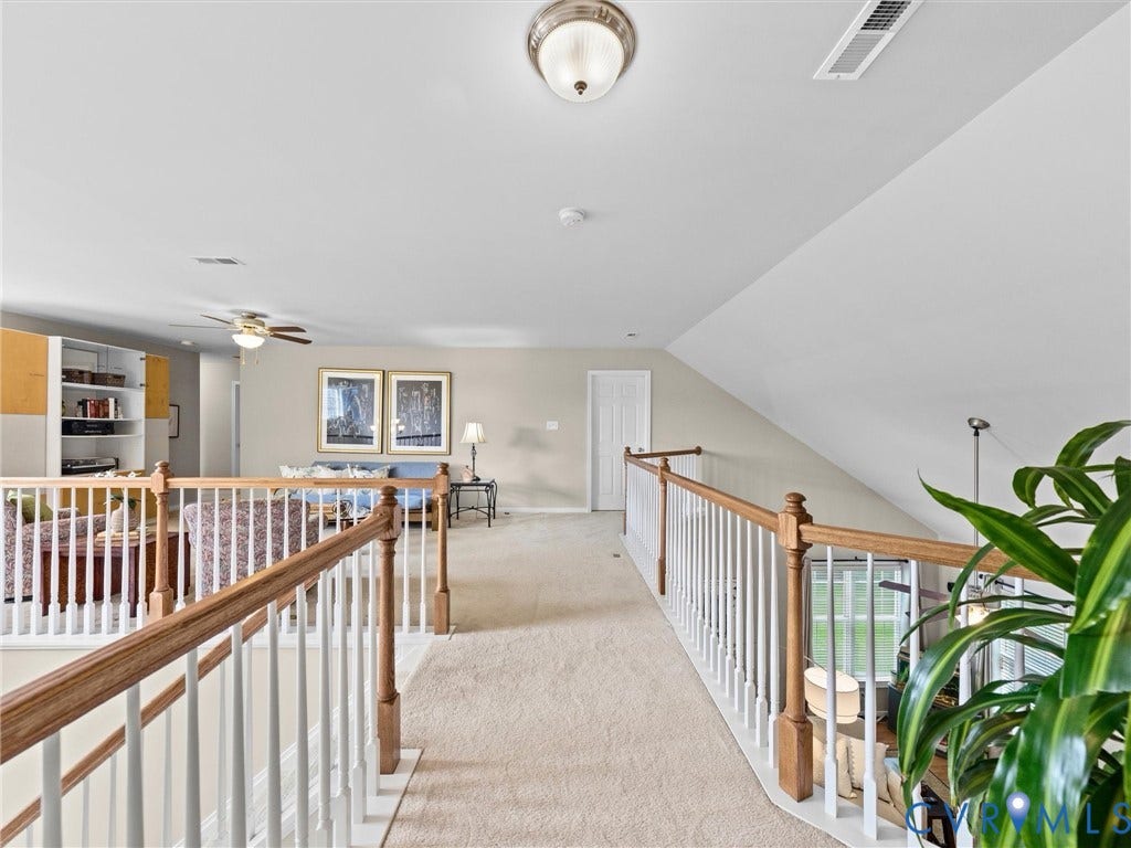 1663 Centerville Parke Lane, The Parke At Centerville, Manakin Sabot, VA 23103 Carpeted loft area featuring a white spindle railing with wood-finish handrails, sloped ceilings, and recessed lighting