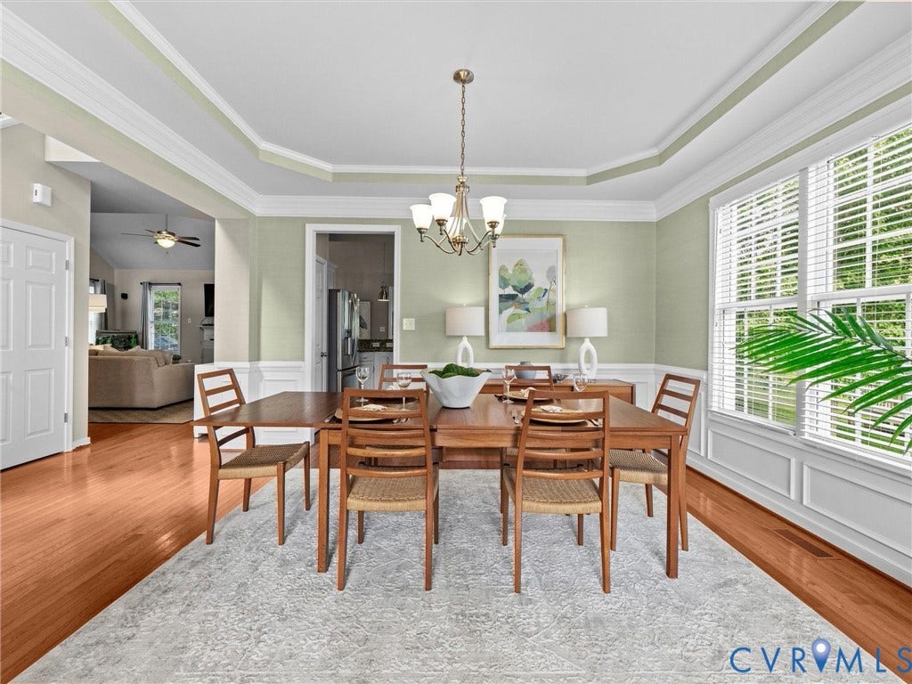 1663 Centerville Parke Lane, The Parke At Centerville, Manakin Sabot, VA 23103 Hardwood flooring, tray ceiling, crown molding, double window, and a chandelier
