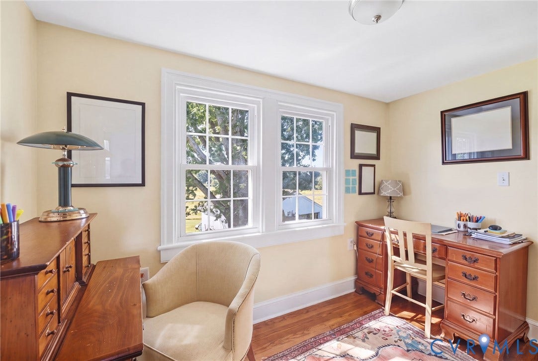 4109 Whitehall Road, Sandy Hook, VA 23153 Hardwood flooring, light-toned wall finishes, and two double-hung windows with white trim
