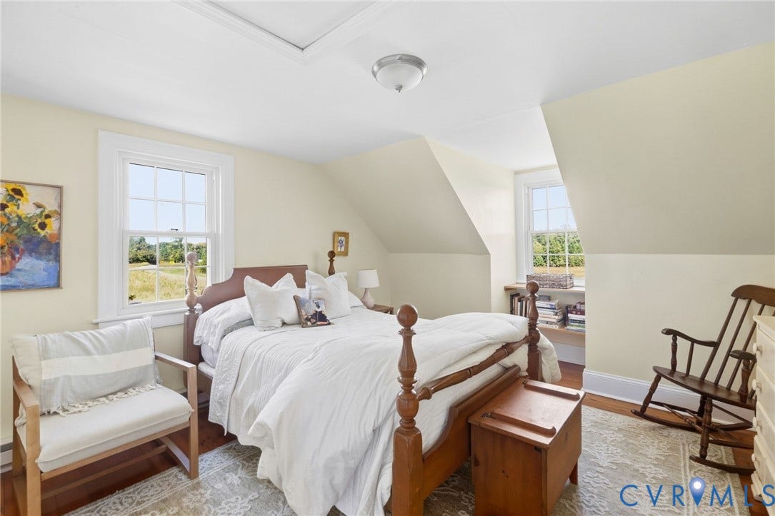 4109 Whitehall Road, Sandy Hook, VA 23153 Hardwood flooring, painted walls, white trim, attic access panel, and a ceiling-mounted light fixture