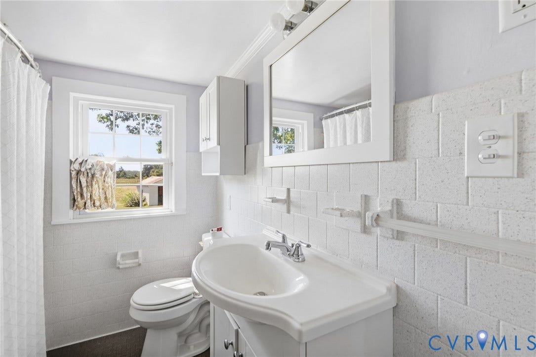 4109 Whitehall Road, Sandy Hook, VA 23153 White subway tile wall surround with integrated shelving