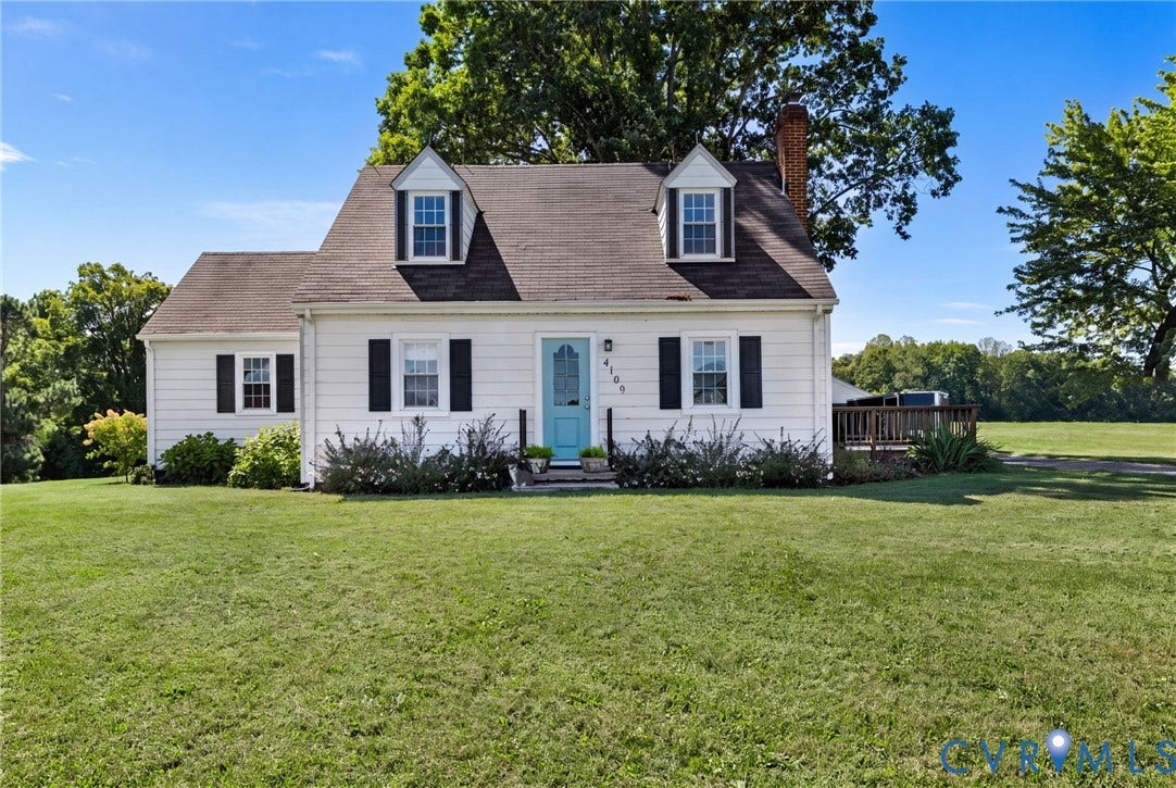4109 Whitehall Road, Sandy Hook, VA 23153 White exterior with black shutters and a light blue entry door