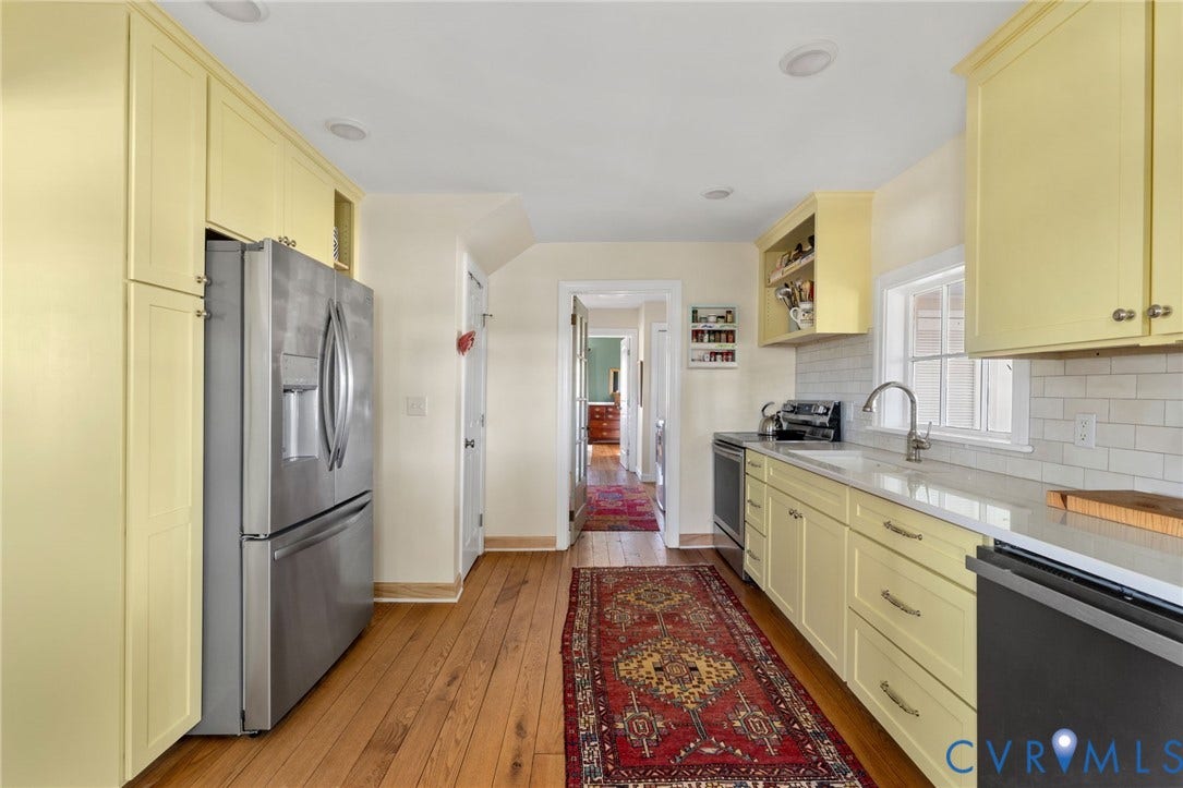4109 Whitehall Road, Sandy Hook, VA 23153 Kitchen featuring wood-finish flooring, recessed lighting, yellow cabinetry, stainless steel appliances, and a subway tile backsplash