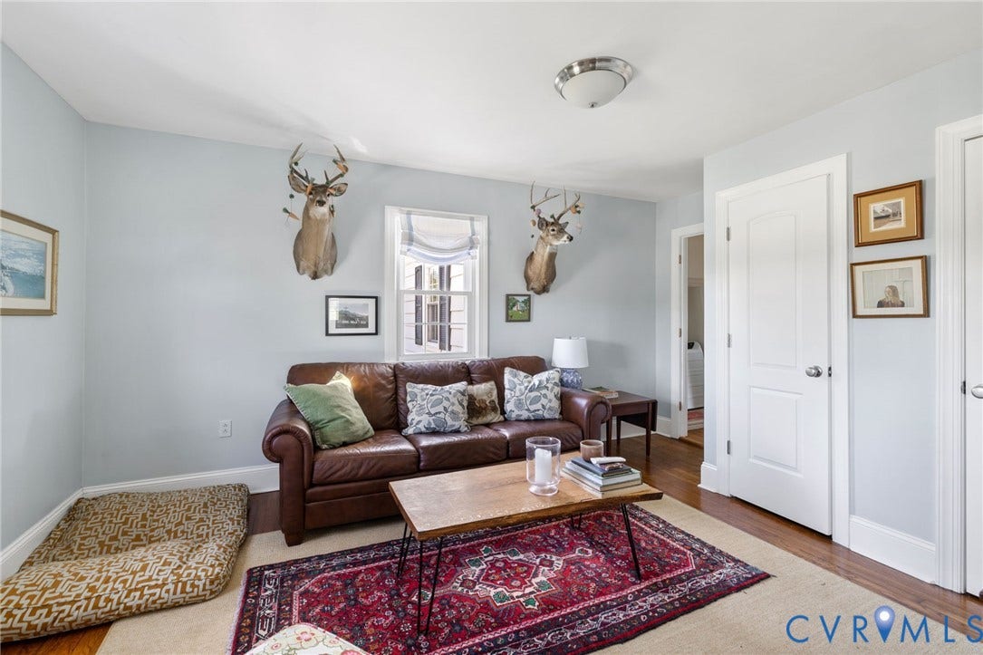 4109 Whitehall Road, Sandy Hook, VA 23153 Hardwood flooring, light blue wall paint, white trim, recessed window, and a flush mount light fixture