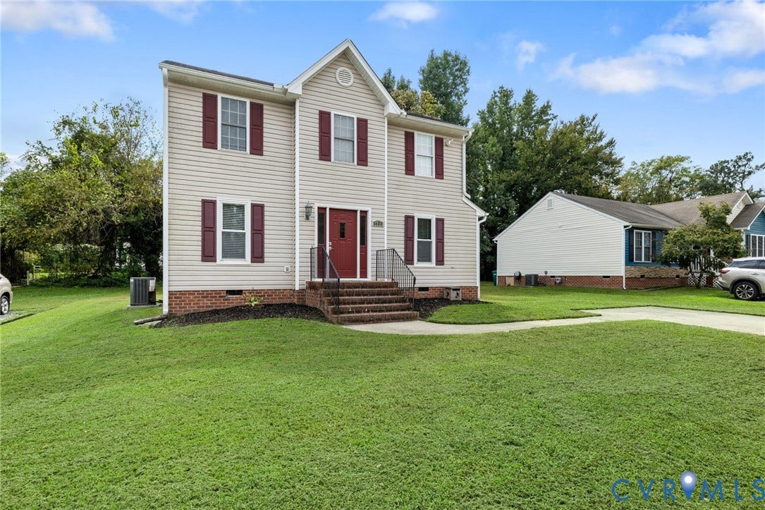 1429 Almondberry Place, Henrico, VA 23231 Two-story residence featuring light-toned siding, red shutters, and a prominent red front door