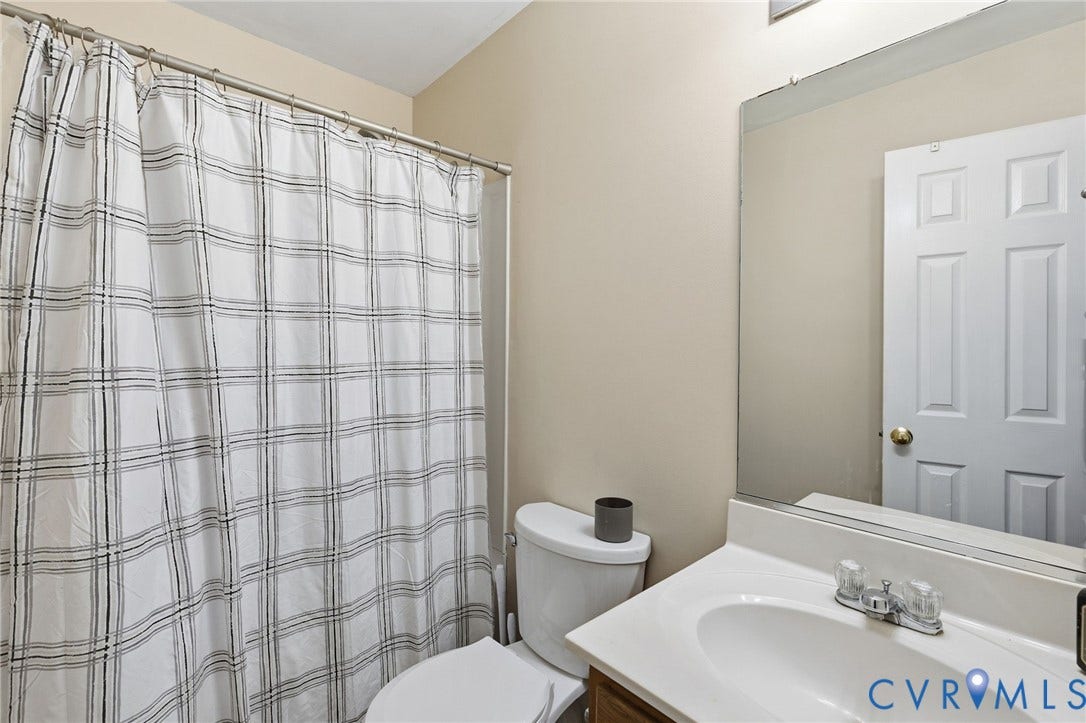 1429 Almondberry Place, Henrico, VA 23231 White vanity with an integrated sink and chrome faucet