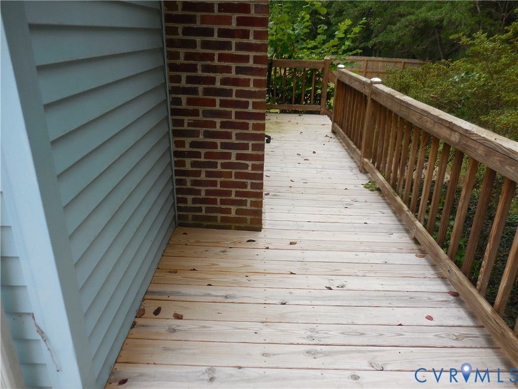 6185 Parrish Road, Louisa, VA 23093 Wood deck with wood railings, brick exterior accent, and light blue siding