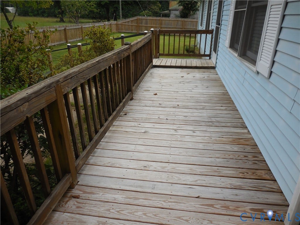 6185 Parrish Road, Louisa, VA 23093 Wood deck with wood railing, light blue siding, and white window shutters