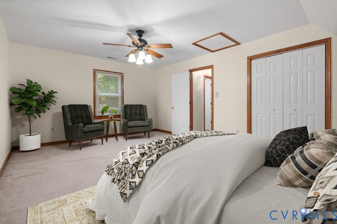 Neutral wall color, ceiling fan with light fixture, window with wood trim, wood-trimmed doorways, and bi-fold closet doors