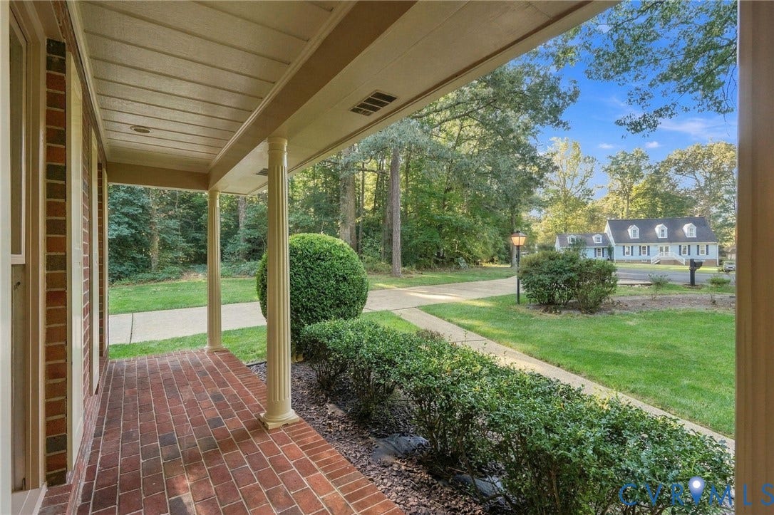Brick paver front porch with architectural columns