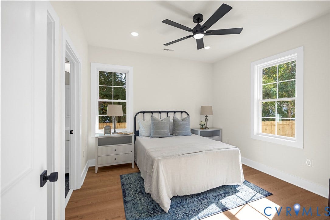 Wood-finish flooring, recessed lighting, and a contemporary ceiling fan