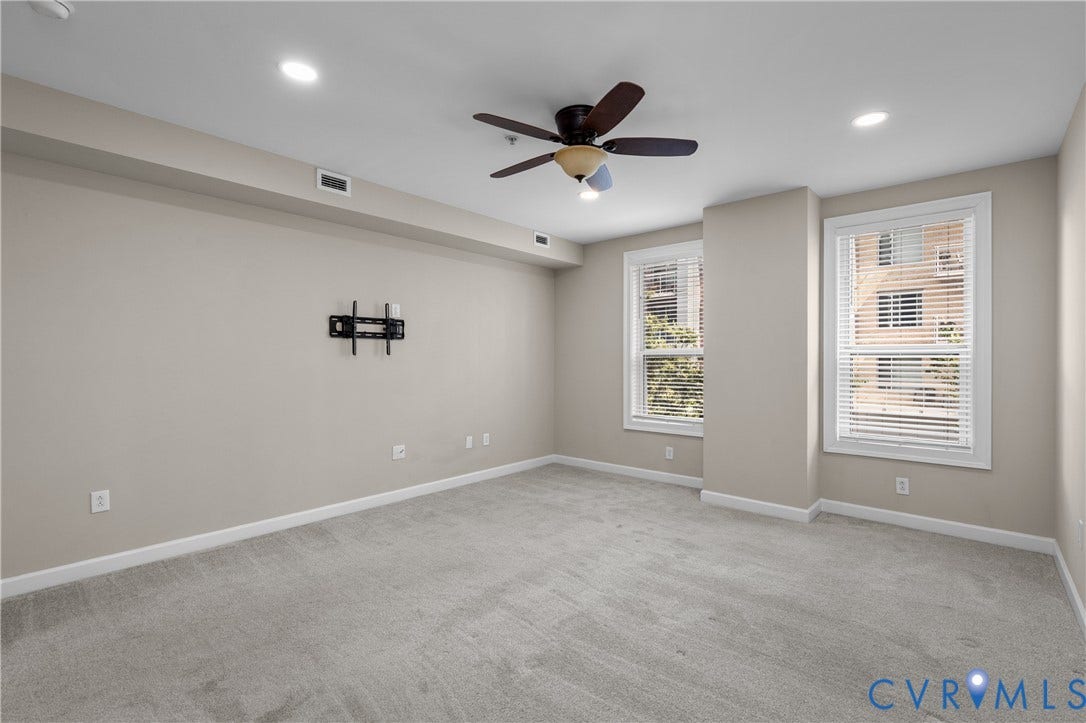 4820 Old Main Street, #301, Henrico, VA 23231 Recessed lighting, ceiling fan with light, light-colored carpeting, two windows with blinds, and a built-in television mount