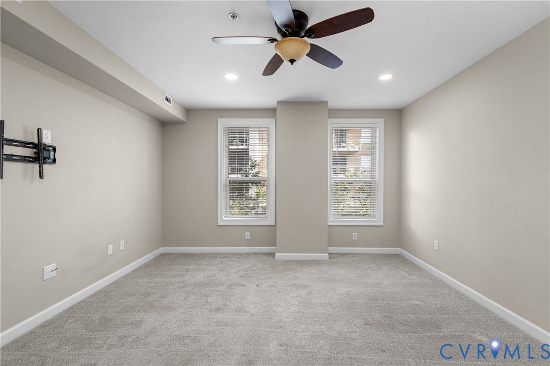 4820 Old Main Street, #301, Henrico, VA 23231 Recessed lighting, ceiling fan, neutral wall paint, two windows with blinds, and light-toned carpeting