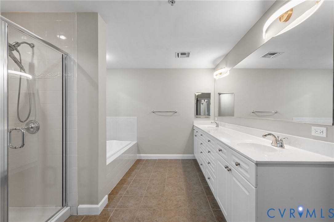 4820 Old Main Street, #301, Henrico, VA 23231 Dual vanity with white cabinetry, a spacious countertop, and integrated sinks