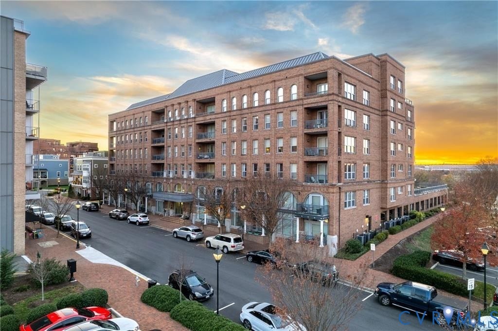 4820 Old Main Street, #301, Henrico, VA 23231 Brick exterior construction with multiple balconies, arched windows, and a metal roof
