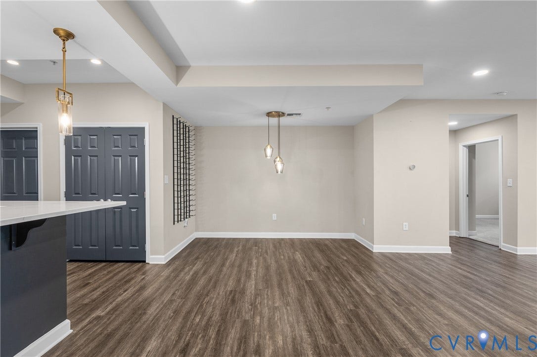 4820 Old Main Street, #301, Henrico, VA 23231 Dining area open to bar and living room, recessed lighting, and a built-in wine rack.