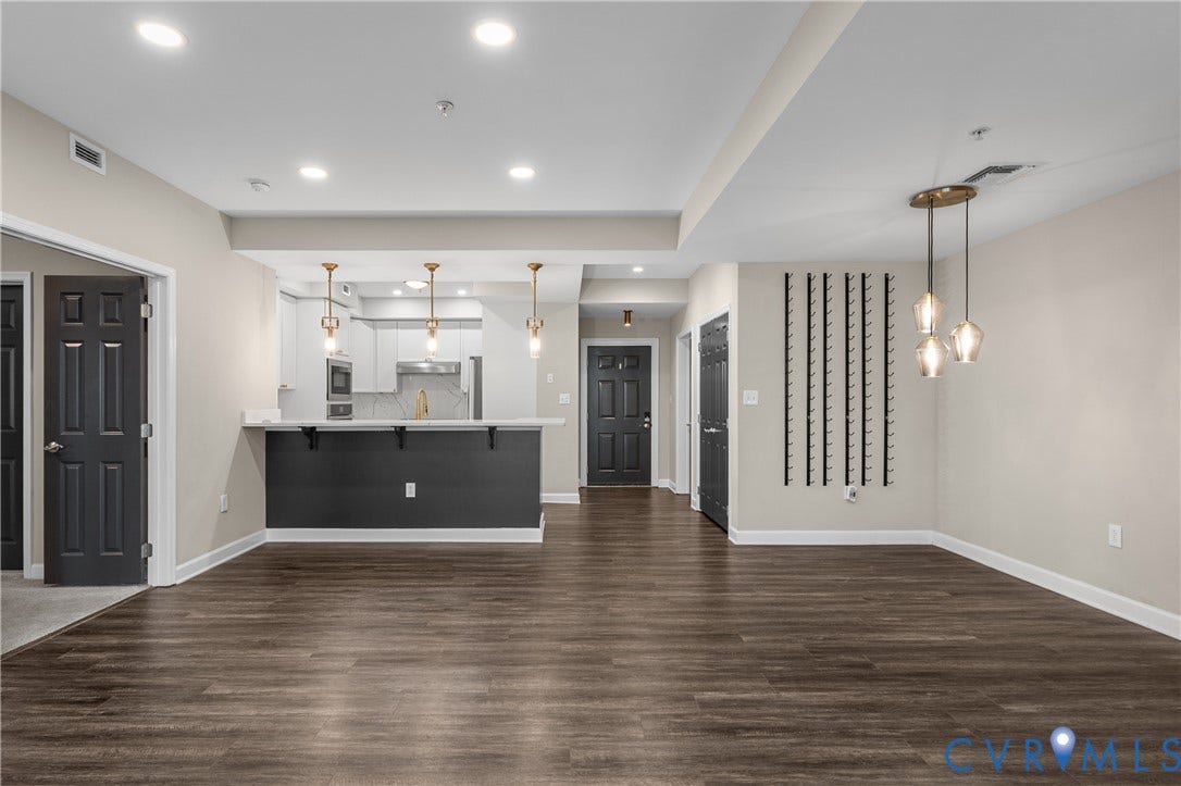 4820 Old Main Street, #301, Henrico, VA 23231 Wood-finish flooring throughout, complemented by recessed lighting and a contemporary chandelier