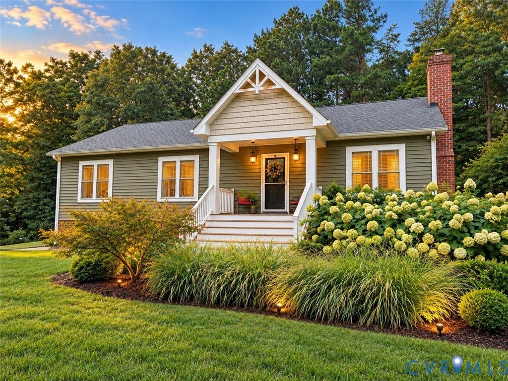 700 Manchester Road, Louisa, VA 23024 Gable roofline with shake siding accent, stone chimney, and front porch with white railing