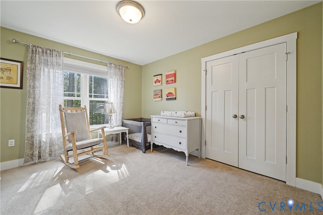 700 Manchester Road, Louisa, VA 23024 Recessed lighting, light-toned carpeting, a window with white trim, and white bi-fold doors