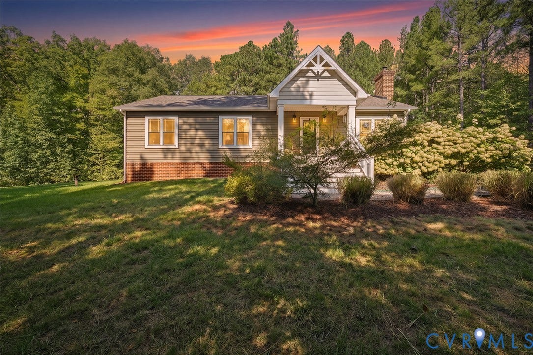 700 Manchester Road, Louisa, VA 23024 Gabled front entry with a covered porch, horizontal siding, brick foundation, and a prominent chimney