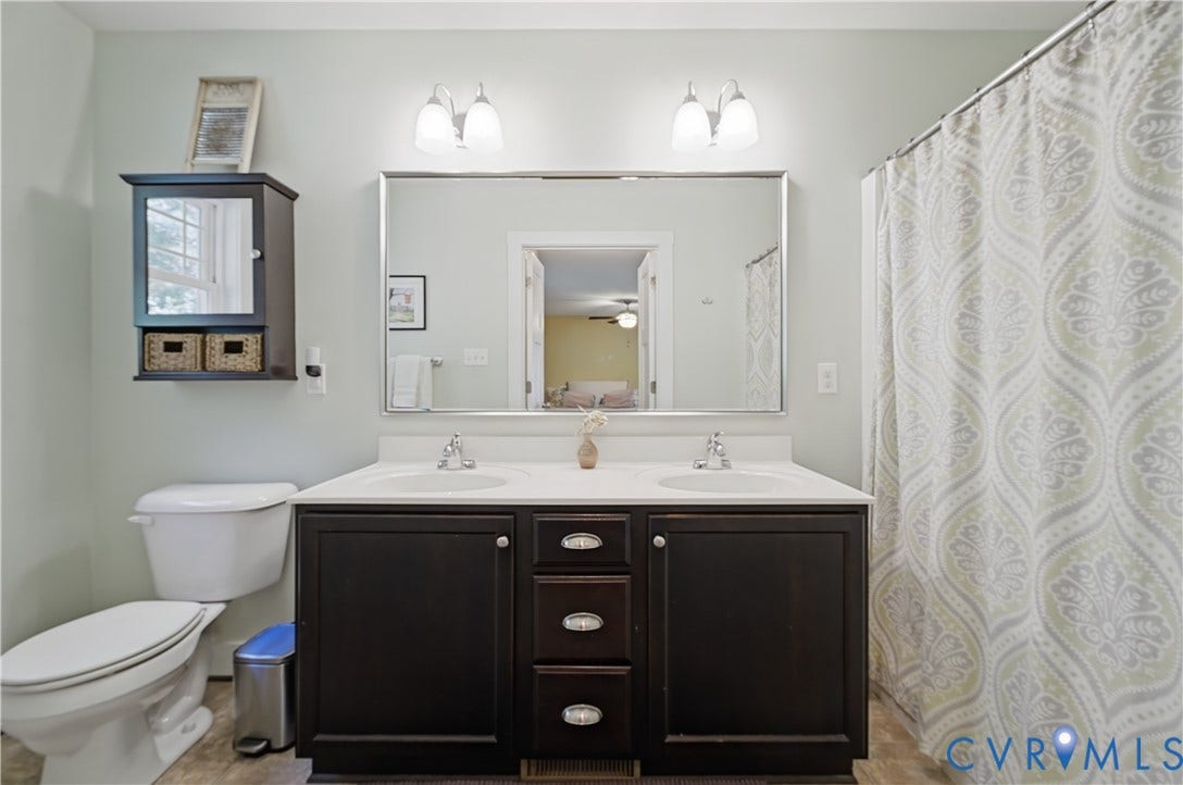 700 Manchester Road, Louisa, VA 23024 Dual vanity with undermount sinks and dark wood cabinetry