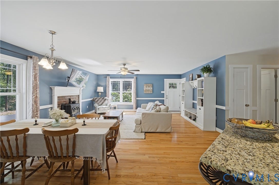 700 Manchester Road, Louisa, VA 23024 Hardwood flooring throughout, recessed lighting, fireplace with wood stove insert, built-in shelving, and white trim