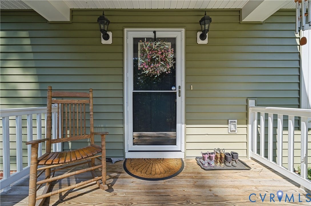 700 Manchester Road, Louisa, VA 23024 Front porch with wood-finish decking and white railings