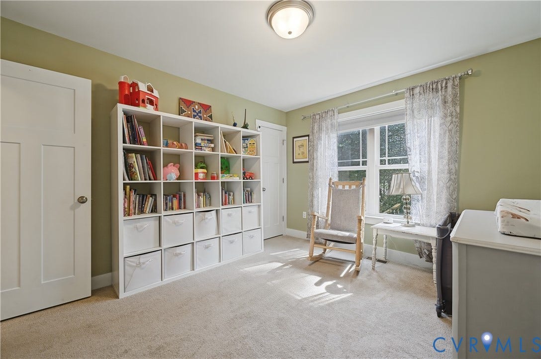 700 Manchester Road, Louisa, VA 23024 Recessed lighting, light-toned carpeting, and a large window providing natural illumination