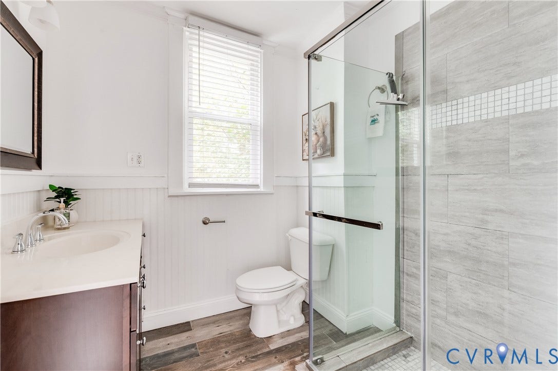 2224 Seminary Avenue, Richmond, VA 23220 Glass-enclosed shower with subway tile and mosaic accent