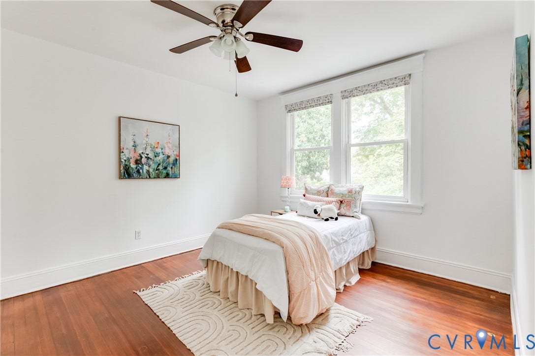 2224 Seminary Avenue, Richmond, VA 23220 Hardwood flooring, white painted walls, white trim, dual windows, and a ceiling fan with light fixture