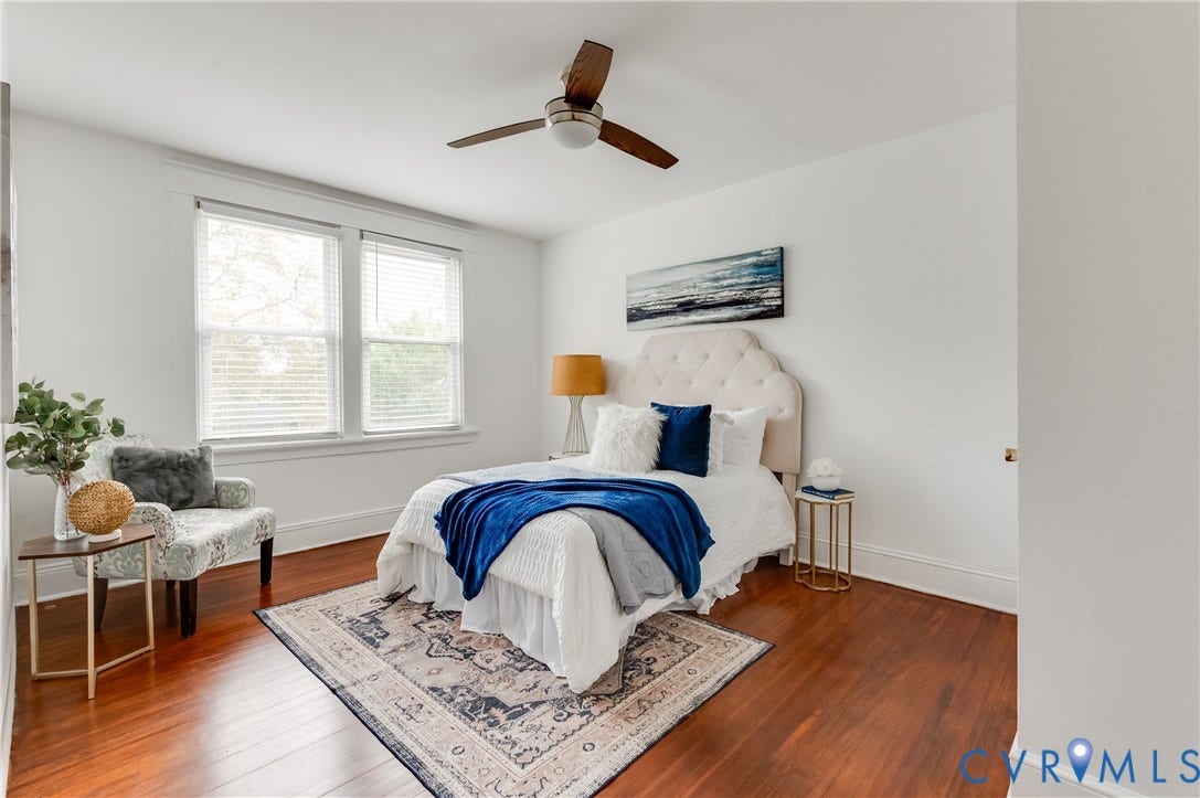 2224 Seminary Avenue, Richmond, VA 23220 Hardwood flooring throughout, two windows with blinds, white walls, and a ceiling fan with light fixture