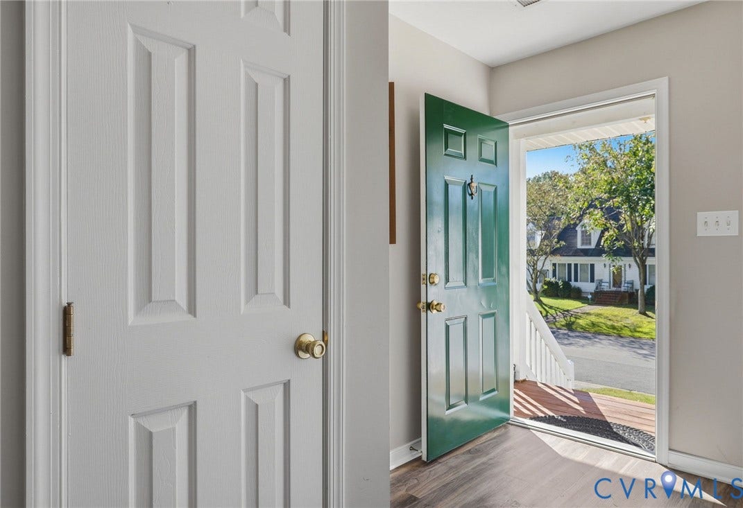 932 Ayers Way, Ayers Tavern, Glen Allen, VA 23060 Entryway featuring a paneled green front door, wood-finish flooring, and a white interior door