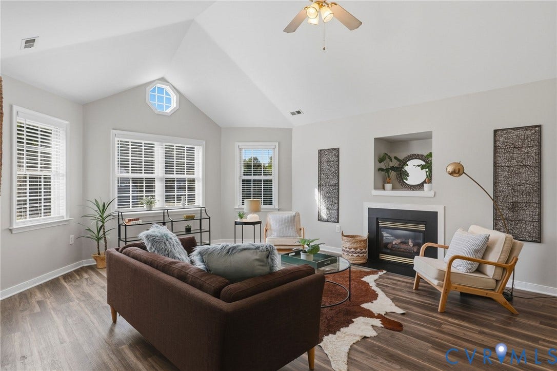 932 Ayers Way, Ayers Tavern, Glen Allen, VA 23060 Vaulted ceiling with ceiling fan, prominent octagonal window, white window blinds, wood-finish flooring, and a built-in fireplace with mantel
