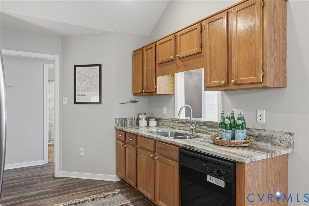 932 Ayers Way, Ayers Tavern, Glen Allen, VA 23060 Kitchen featuring wood cabinetry, a stainless steel sink, a black dishwasher, and stone countertops