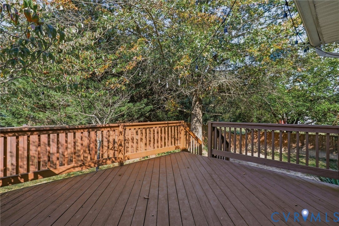 932 Ayers Way, Ayers Tavern, Glen Allen, VA 23060 Expansive wood deck with a perimeter railing and integrated steps, surrounded by mature trees