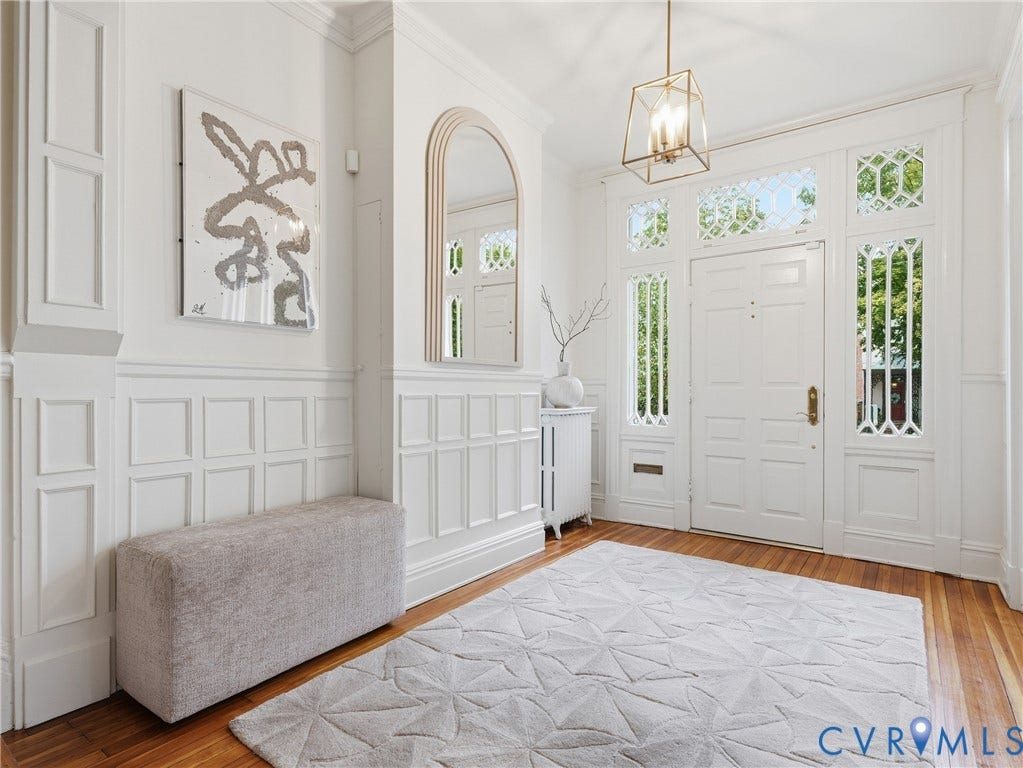 1901 Hanover Avenue, Fan, Richmond, VA 23220 Hardwood flooring, paneled wainscoting, intricate transom windows, and a decorative pendant light fixture