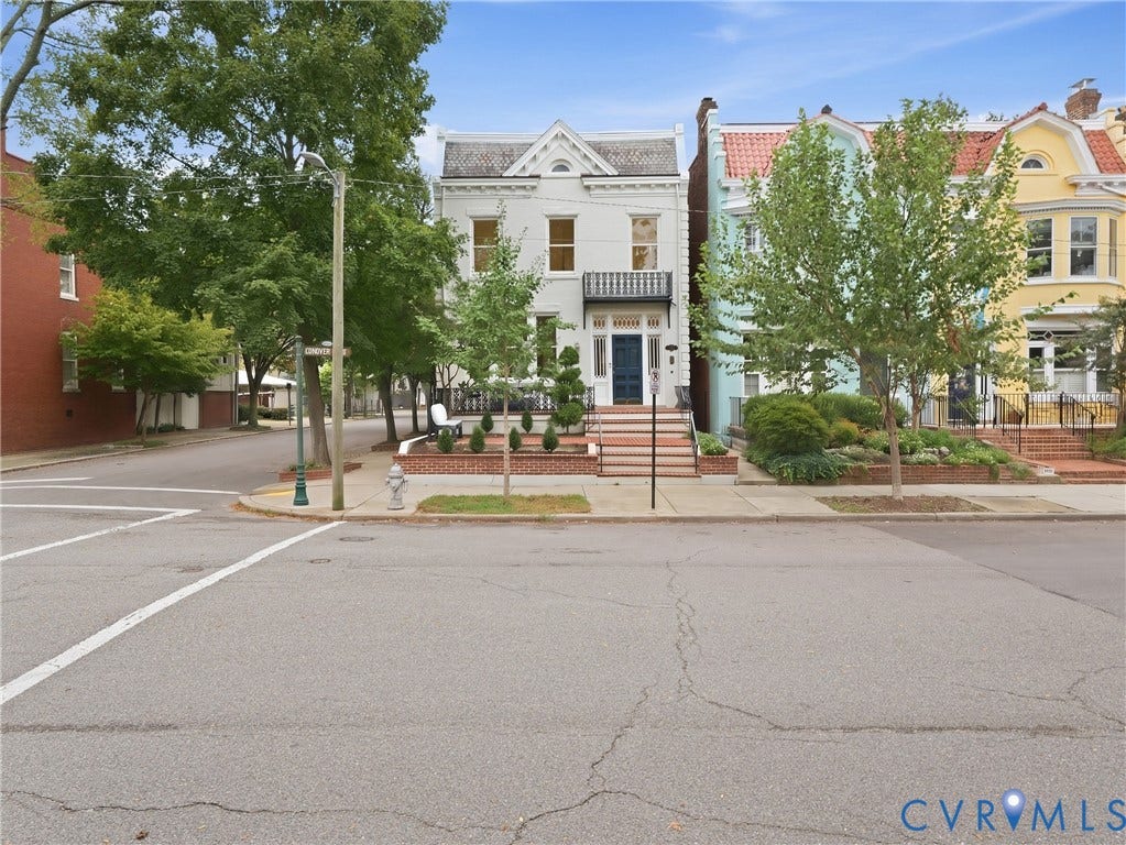 1901 Hanover Avenue, Fan, Richmond, VA 23220 White facade with dark trim windows, covered front entrance, and an upper-level balcony
