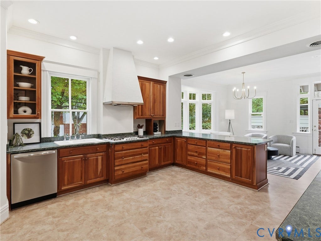 1901 Hanover Avenue, Fan, Richmond, VA 23220 Kitchen featuring wood cabinetry, dark countertops, a stainless steel dishwasher, and a white range hood