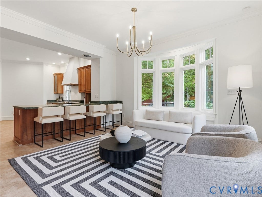 1901 Hanover Avenue, Fan, Richmond, VA 23220 Recessed lighting, wood-finish flooring, a kitchen island with seating, upper and lower wood cabinetry, and a large bay window