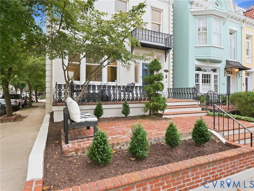 1901 Hanover Avenue, Fan, Richmond, VA 23220 Brick patio with a decorative black iron railing, brick retaining wall, and mature landscaping