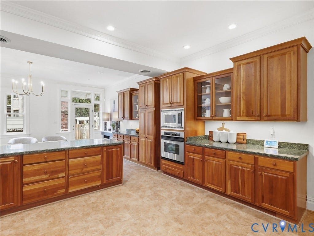 1901 Hanover Avenue, Fan, Richmond, VA 23220 Wood-finish cabinetry with glass-front accents, stainless steel built-in appliances, stone countertops, and recessed lighting