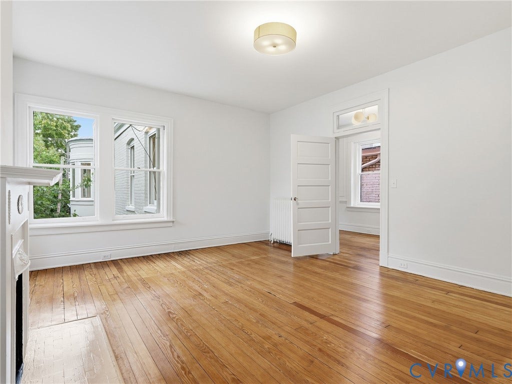 1901 Hanover Avenue, Fan, Richmond, VA 23220 Hardwood flooring, painted white walls, white trim, transom window, and a built-in fireplace