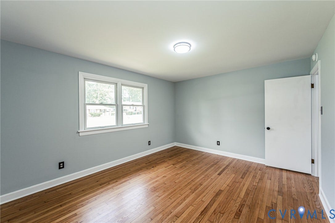 1724 Alaska Drive, Richmond, VA 23224 Hardwood flooring, light gray wall finish, white trim throughout, double window, and flush mount lighting
