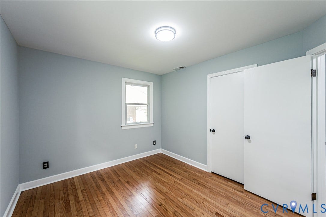 1724 Alaska Drive, Richmond, VA 23224 Hardwood flooring throughout, white trim, single window, and a flush mount ceiling fixture