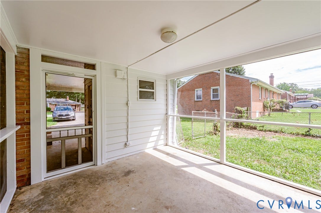 1724 Alaska Drive, Richmond, VA 23224 Screened porch with a concrete floor, white siding, and a ceiling-mounted light fixture
